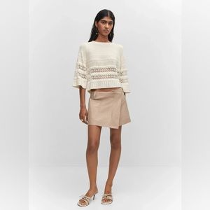 Openwork sweater with flared sleeves
